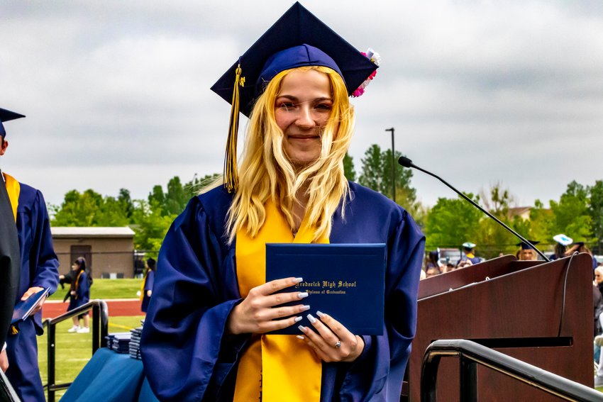 Yes, Hannah Rolf. That is your high-school graduation diploma to preserve for all time. She makes her way off the main stage after receiving her sheepskin during Frederick’s commencement program May 29.